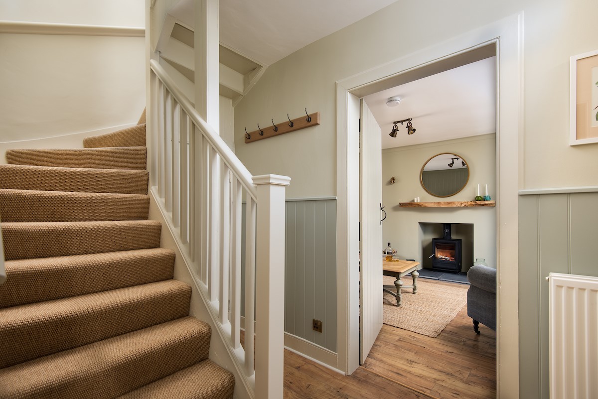 Campsie Cottage - the timber floors, panel-boarded walls and winding coir-carpeted staircase offer an inviting welcome