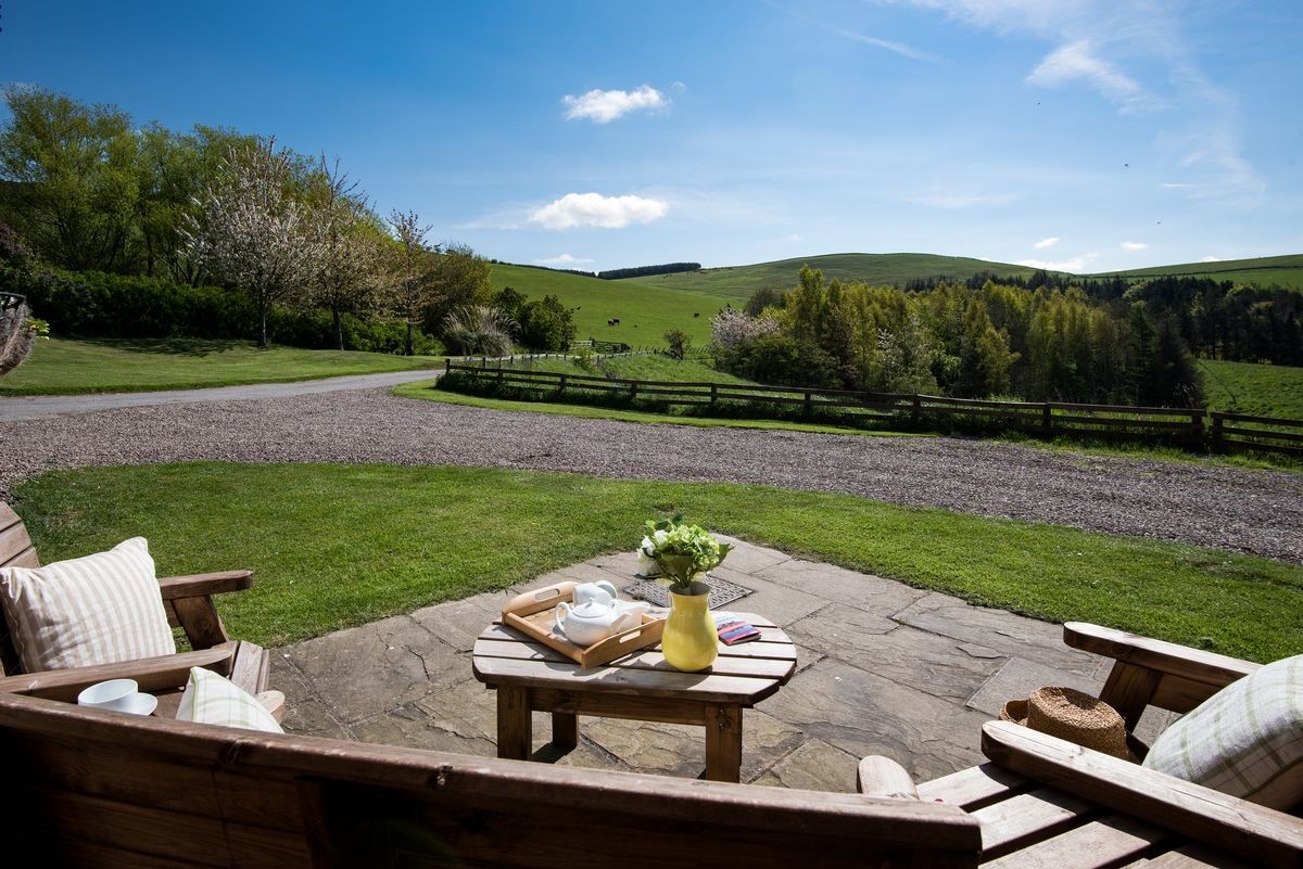 College Cottage - enjoy the stunning scenery from the outside furniture with a pot of tea
