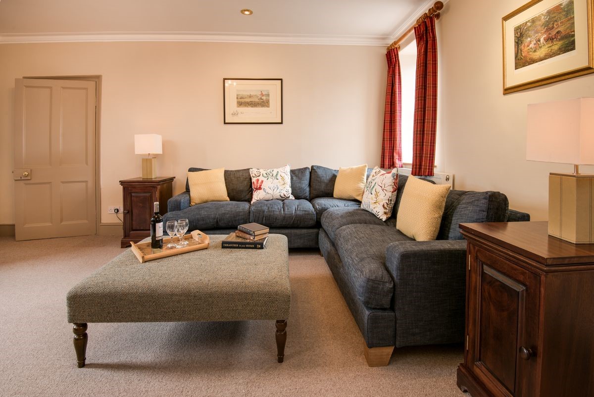 Bowmont Cottage - large corner sofa in the sitting room
