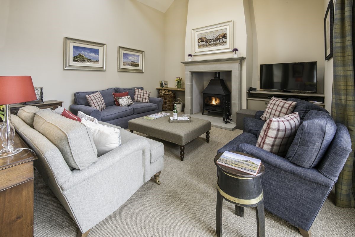 Crookhouse Mill - open-plan sitting room with ample seating, wood burning stove and TV