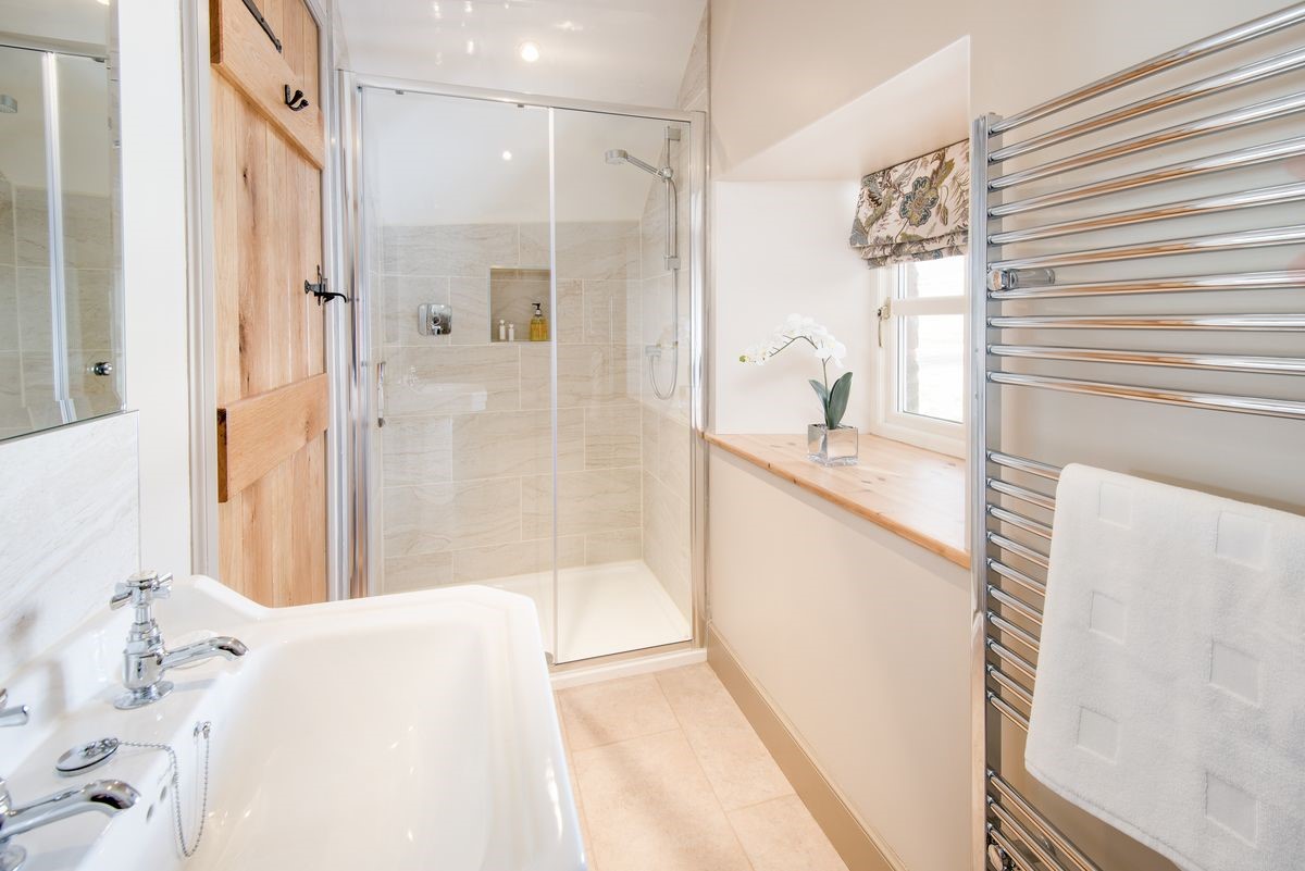 Crookhouse Mill - bedroom two en suite bathroom on the first floor with walk-in shower, WC and basin