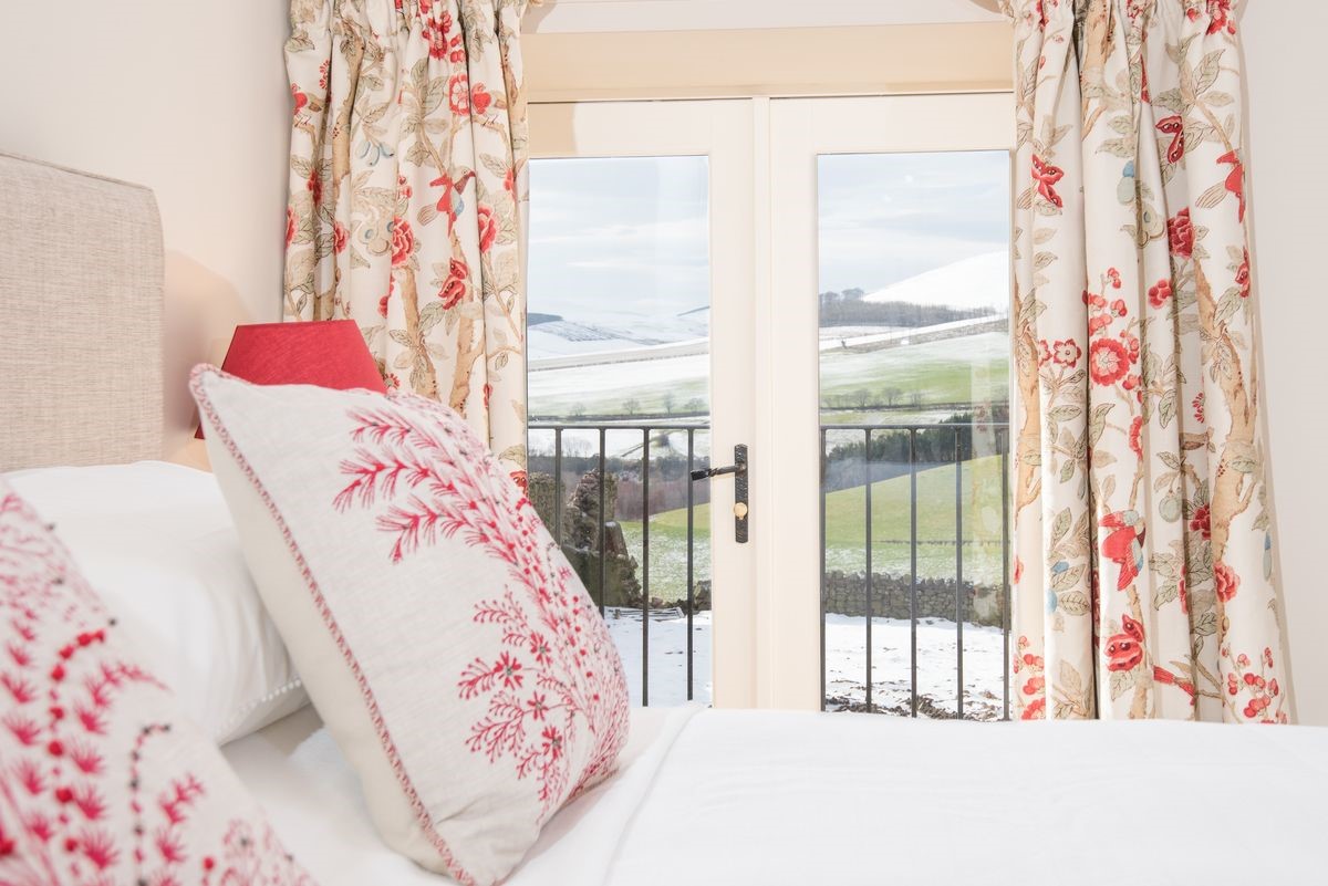 Crookhouse Mill - bedroom four with Juliet balcony and views over the Northumbrian countryside