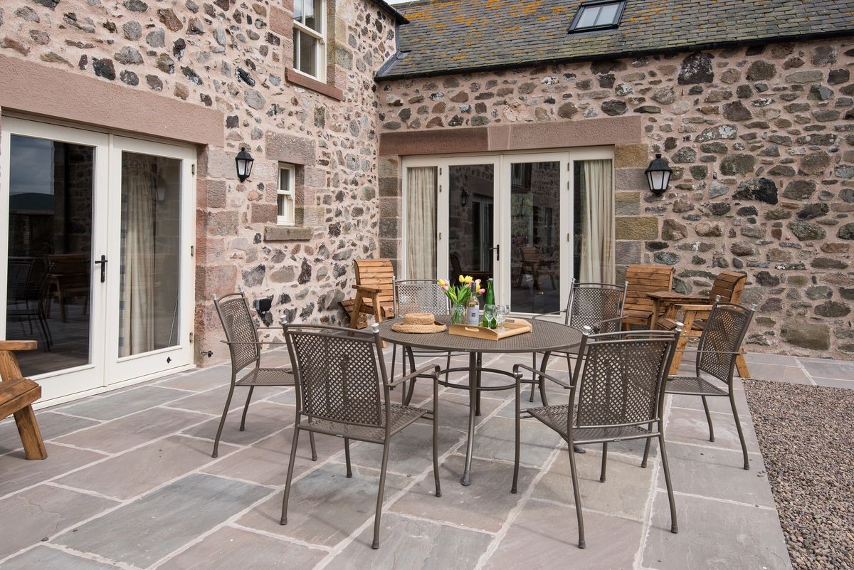 Crookhouse Mill - patio area with garden furniture accessible from the kitchen and the living area