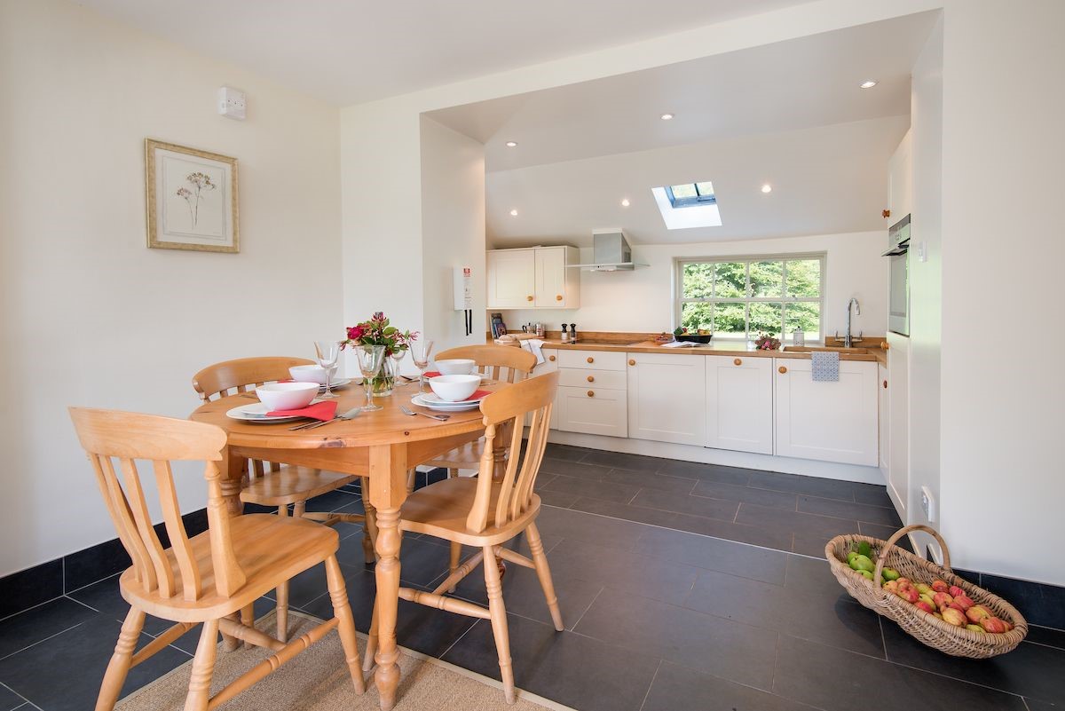 Garden Cottage - kitchen and dining area with seating for four guests