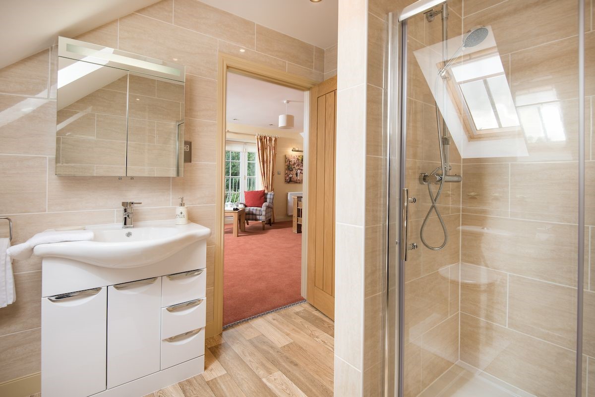 Dryburgh Farmhouse - bedroom two en suite shower room featuring a rainforest shower head and heated towel rail