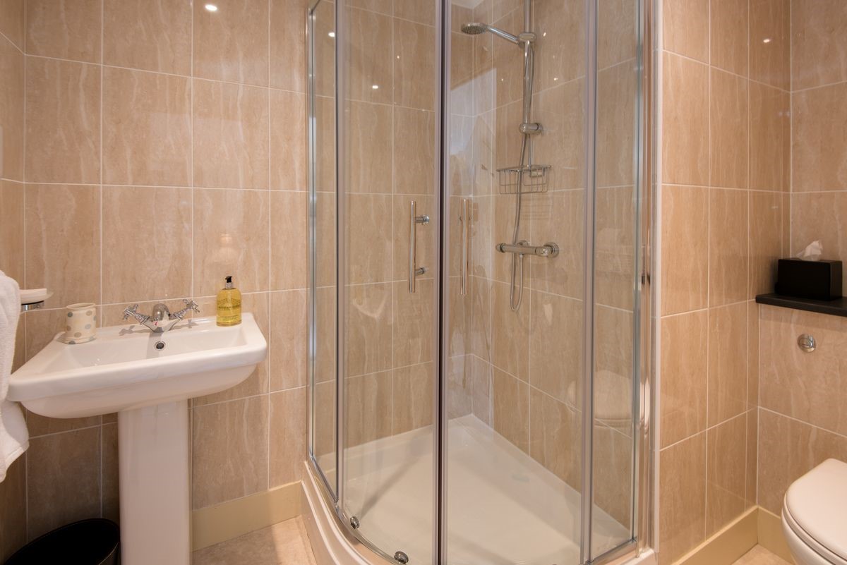 Dryburgh Stirling One - bedroom two en suite bathroom with walk-in shower, WC and basin