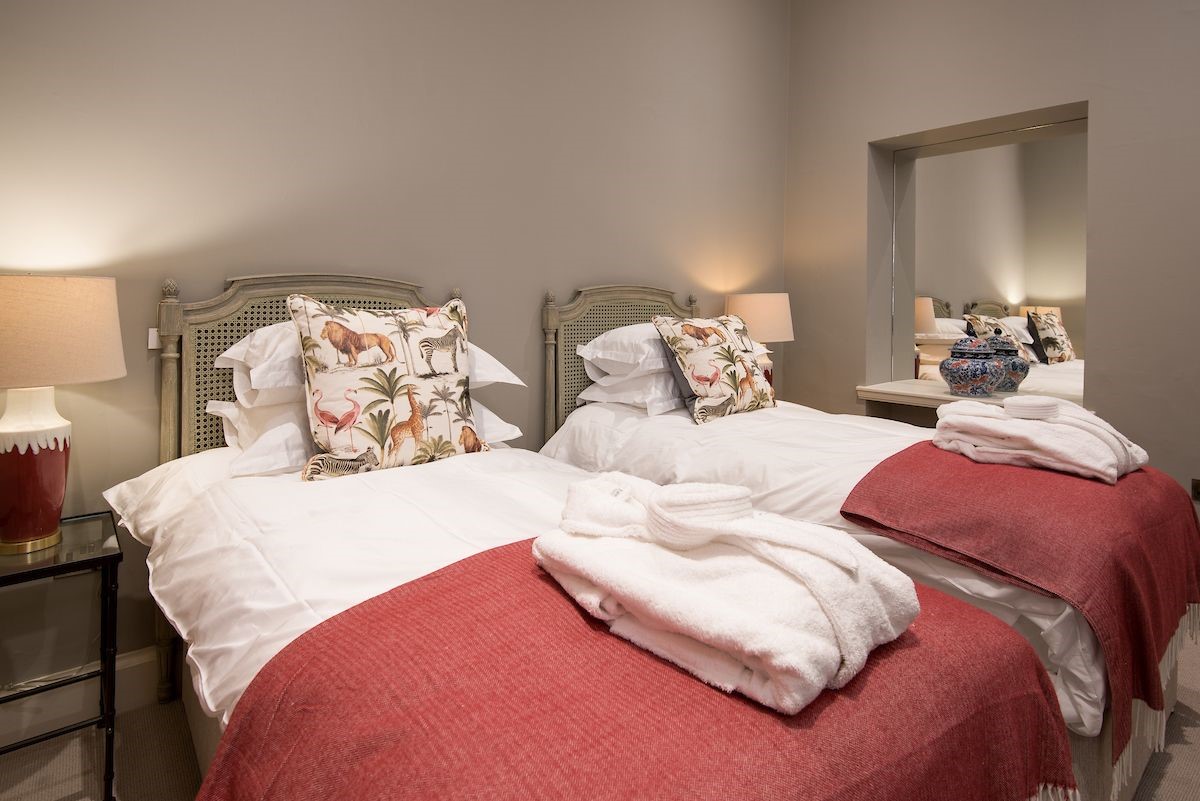 The Maitland Apartment - bedroom two with zip and link beds