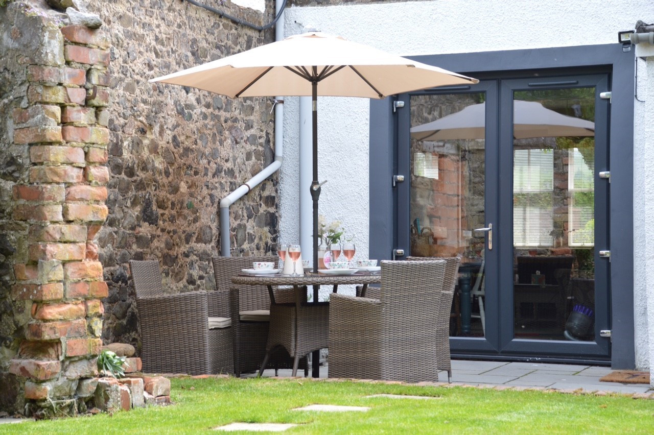 Chestnut Cottage - the garden to the rear with patio and garden furniture