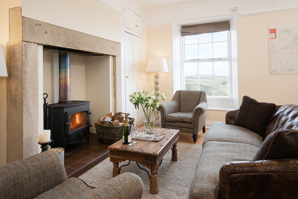 Dipper Cottage - cosy sitting room with inglenook fireplace and wood burning stove