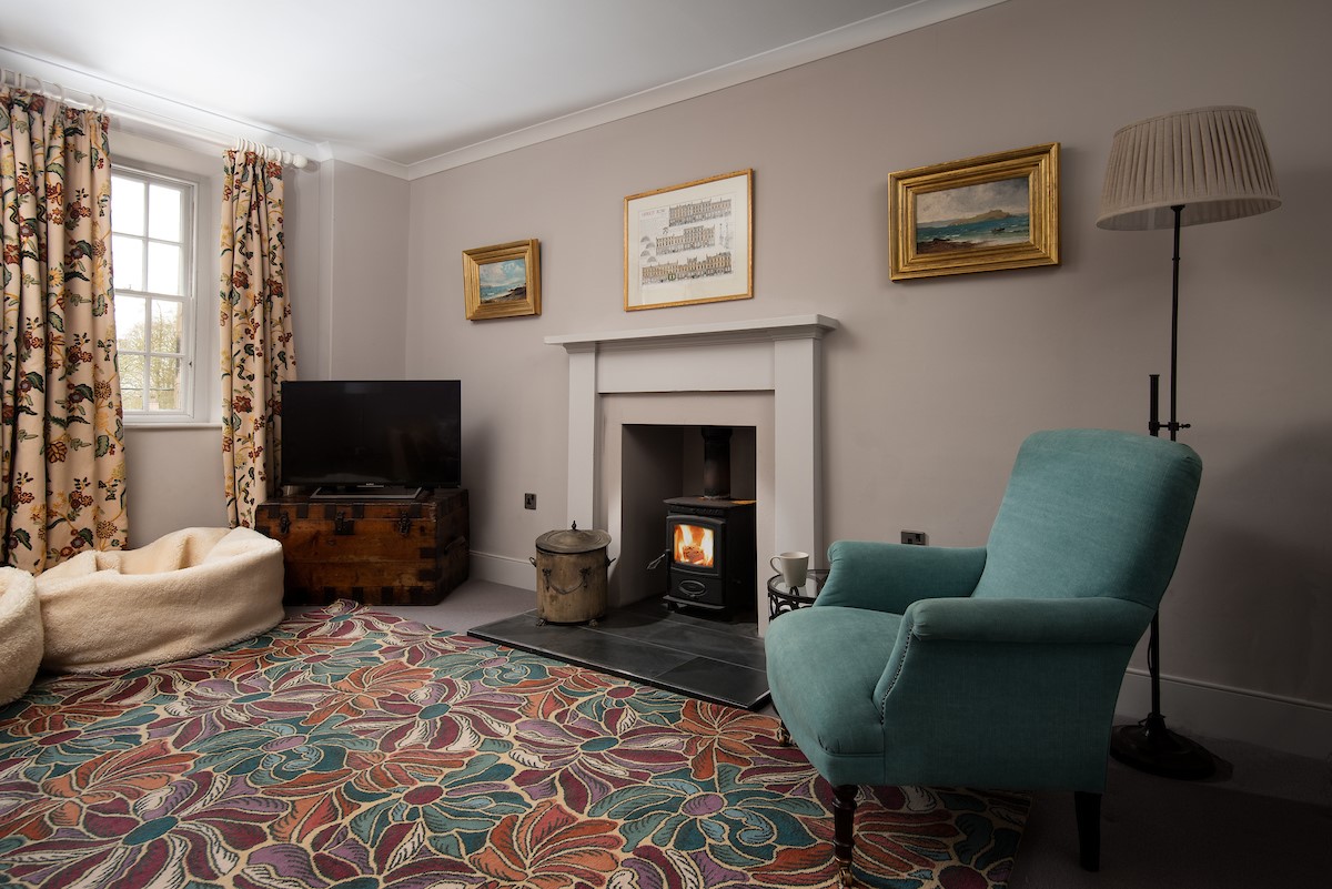 Old Purves Hall - cosy second floor sitting room with wood burning stove and TV