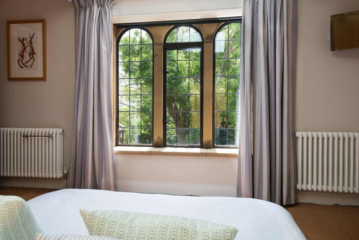 Poppy House - period feature windows in the twin bedroom
