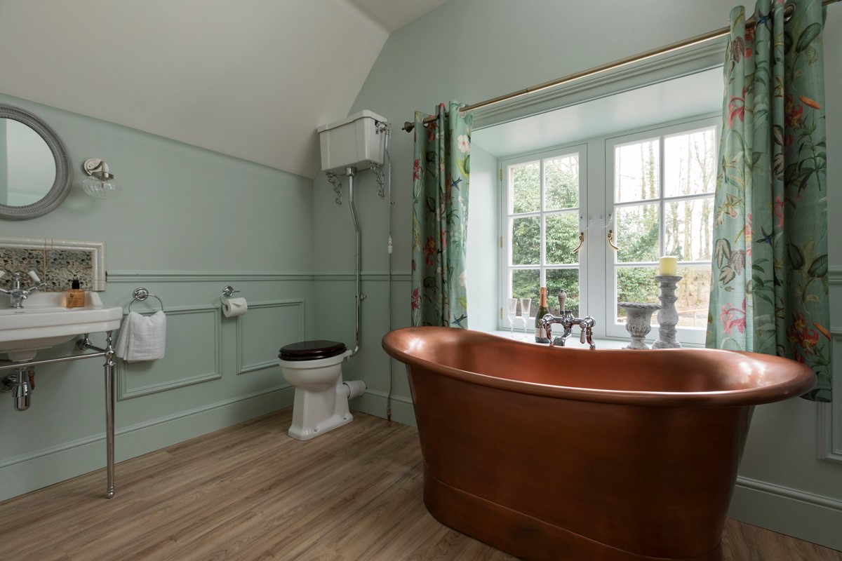 Gardener's Cottage, Twizell Estate - free-standing copper bath in the family bathroom