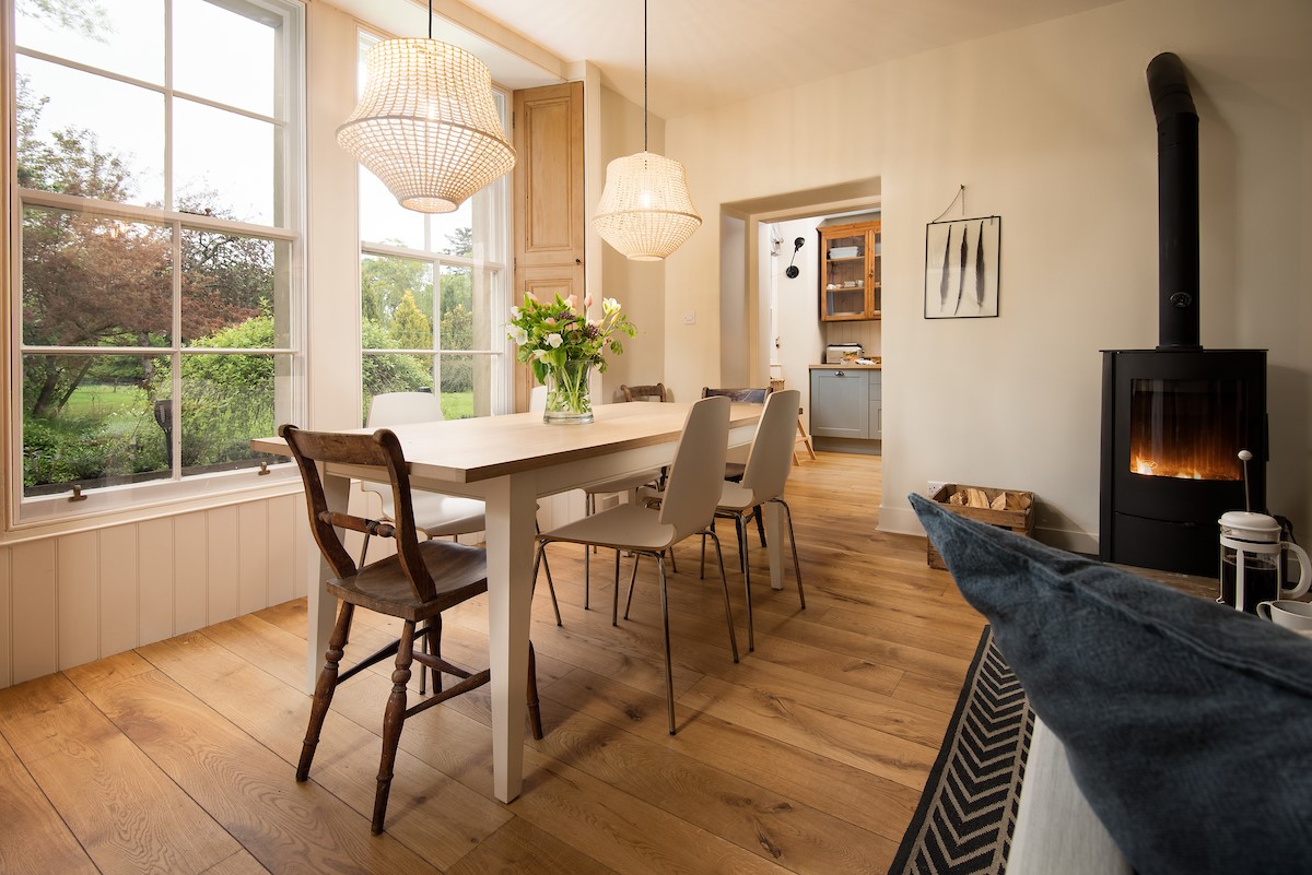 Trouthouse - the open-plan living space leads through from the kitchen and benefits from a large bay window overlooking the owner's garden to the rear