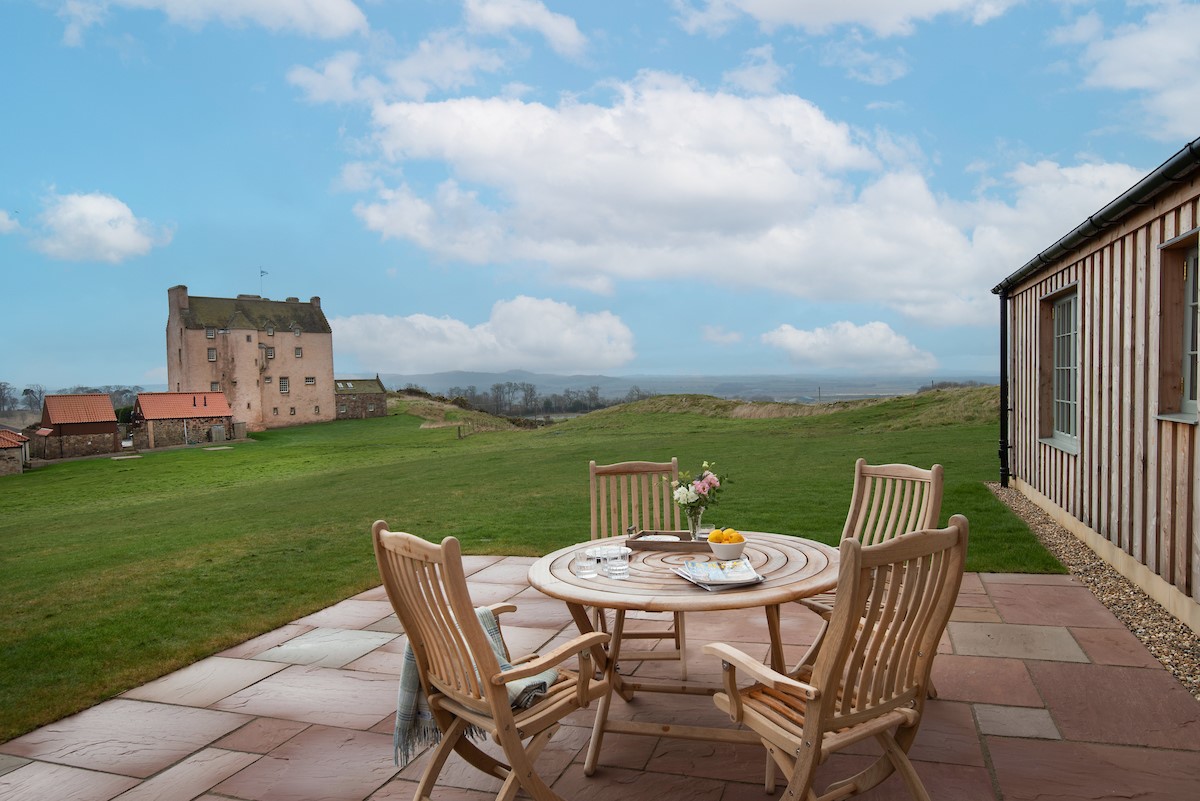 Hillside Cottage - experience al fresco dining on the patio with views of Fenton Tower