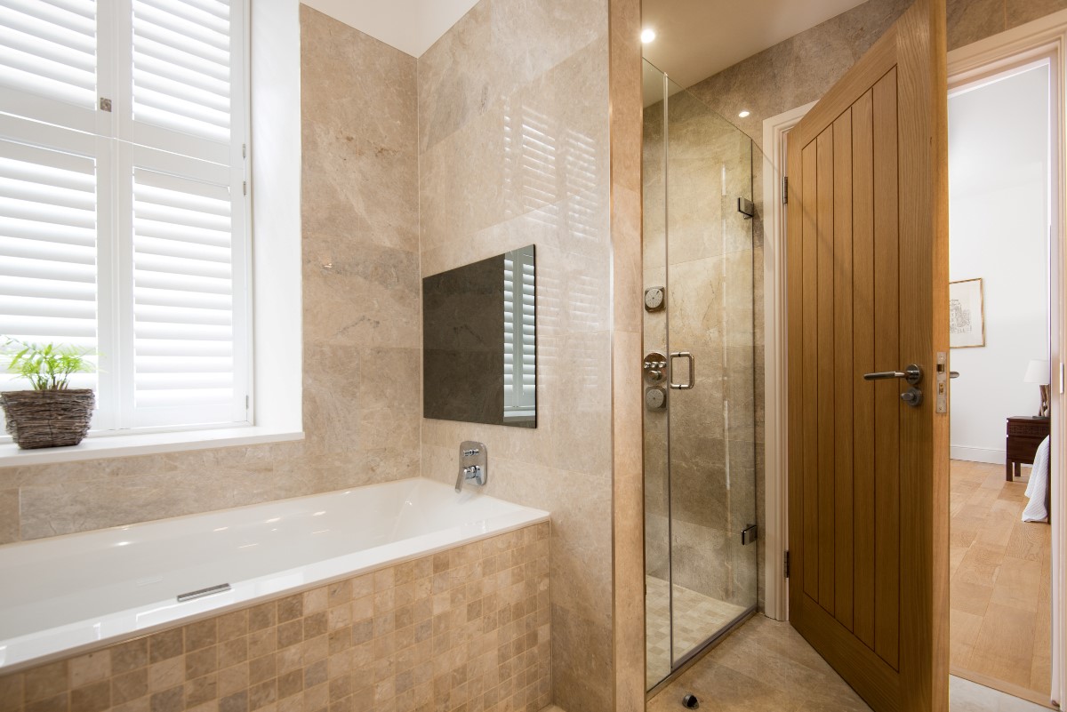 Number One Clayport Street - bedroom one en suite bathroom with bath, TV and en suite shower