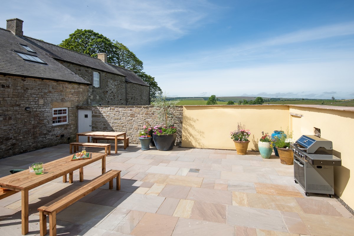 Fell End - two dining tables with bench seating are provided to enjoy barbeque meals