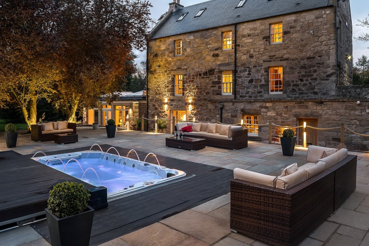 The Old Millhouse - the outside seating area overlooking the swim spa
