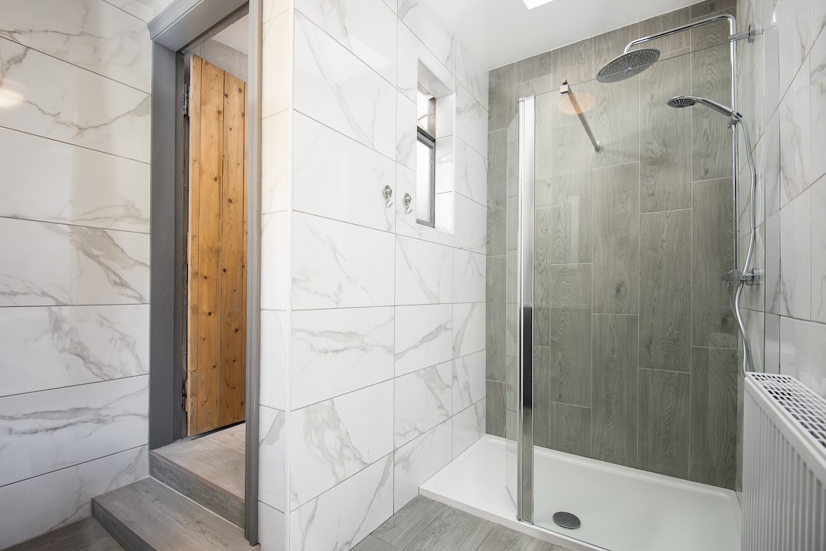 West Mill Cottage - the ground floor shower/utility room features a large walk-in shower with luxurious rainfall shower head
