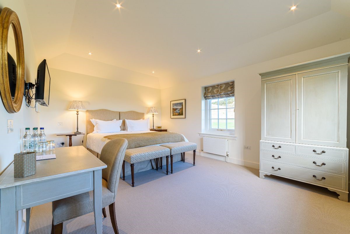 Fenton Lodge - North bedroom with zip and link beds, wardrobe, side tables, TV and dressing table