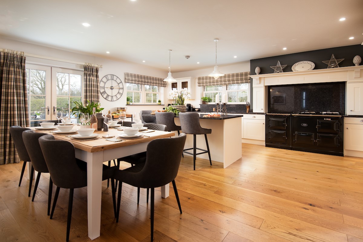 Bracken Lodge - open-plan kitchen and dining space with feature jet black AGA and ample seating