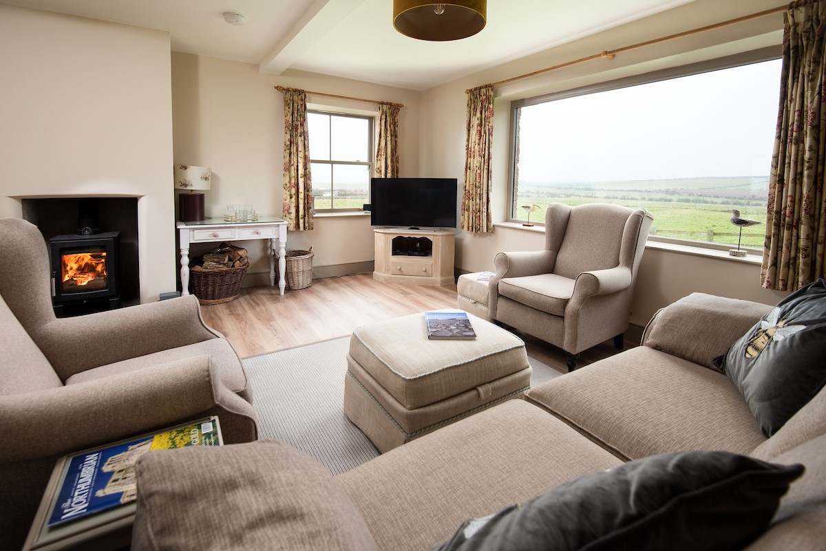 Bee Cottage - enjoy panoramic views towards Holy Island from the comfort of the sitting room