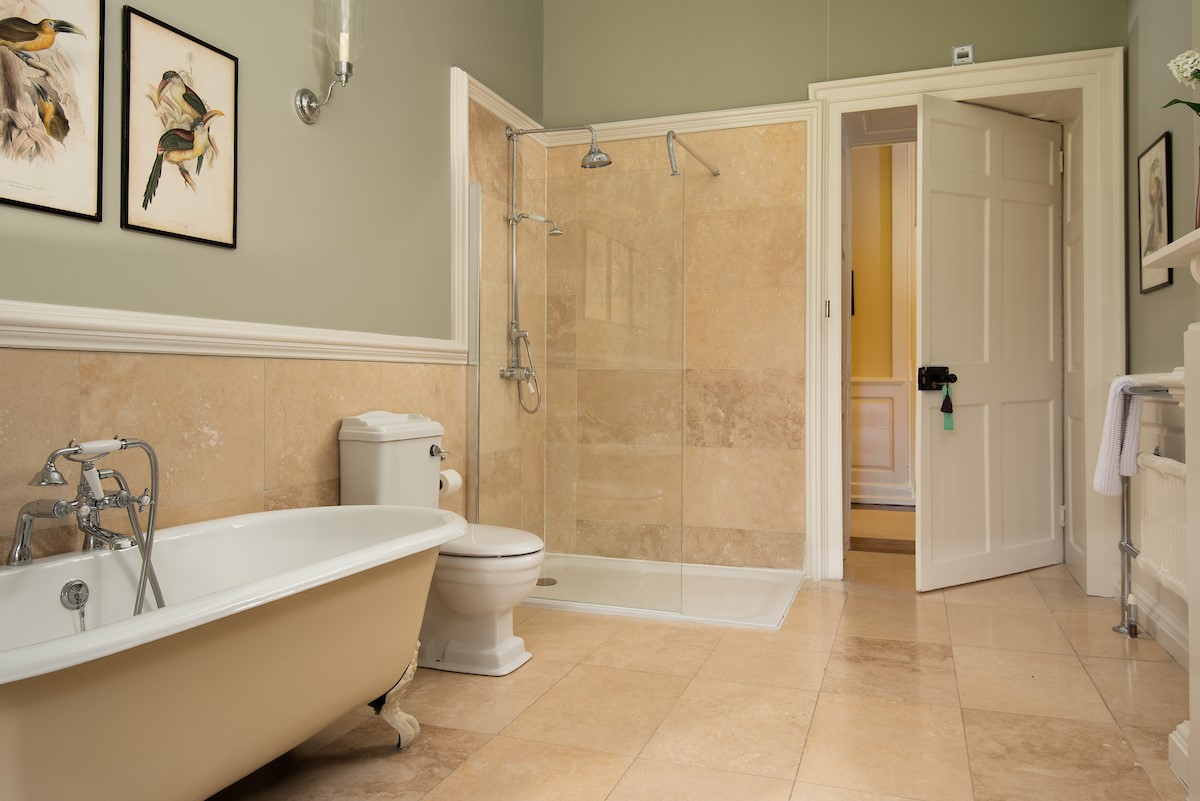 Eslington East Wing - bedroom one en-suite bathroom with roll-top bath a separate walk-in shower