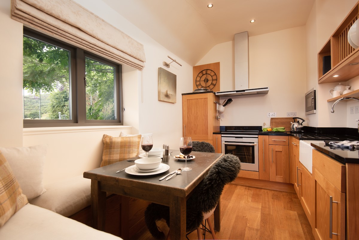 Bay View Cottage - the kitchen with views to the wisteria terrace