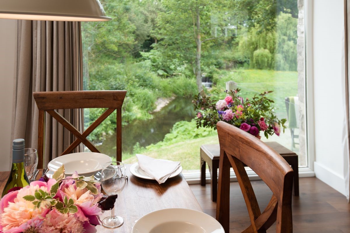 Brunton Burn - dining table with view of the burn