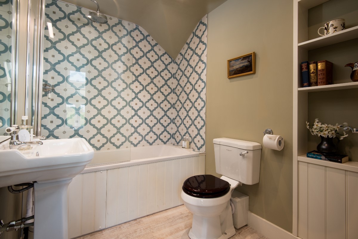Brunton Granary - en-suite bathroom with shower over, WC, and basin