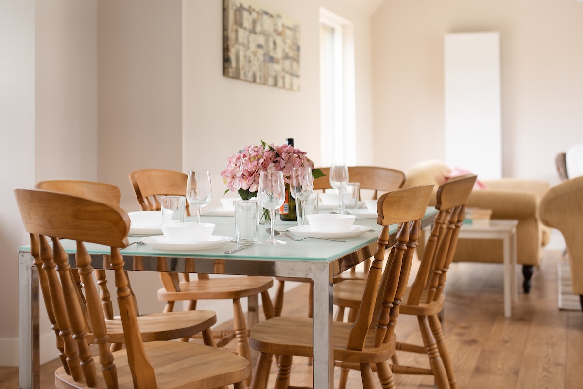 Coldwells Farmhouse - glass top dining table, perfect for enjoying evening meals with the family