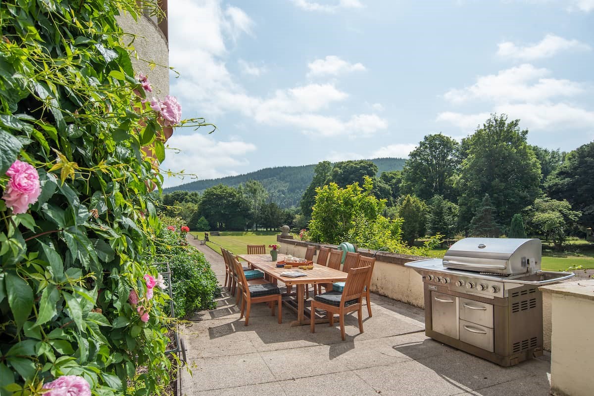 Fairnilee House - outdoor dining area on the terrace with a gas barbecue and seating for 12 guests