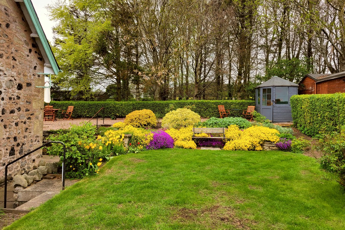 Bughtrig Cottage - garden with colourful planting