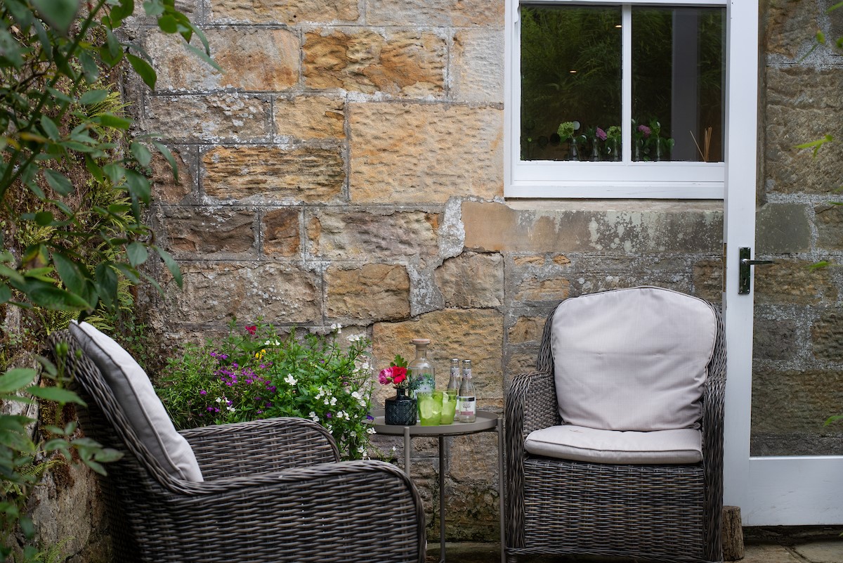 Priory Cottage - comfortable outdoor seating for guests to relax and enjoy a glass of wine