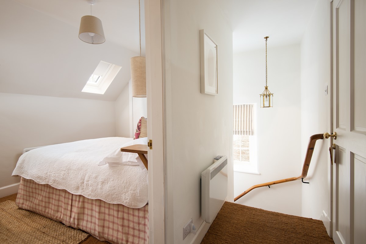 Swan's Nest - cosy bedroom with double bed on the first floor