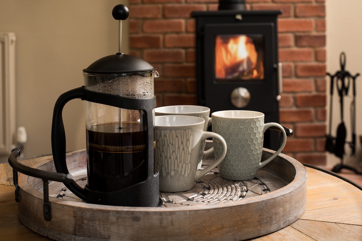 Willow Cottage - curl up in front of the wood burner with a hot brew