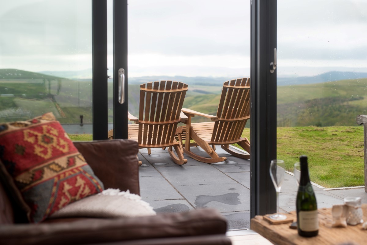 The Maple - relax on the sofa after a day of exploring and enjoy the views with a glass of wine