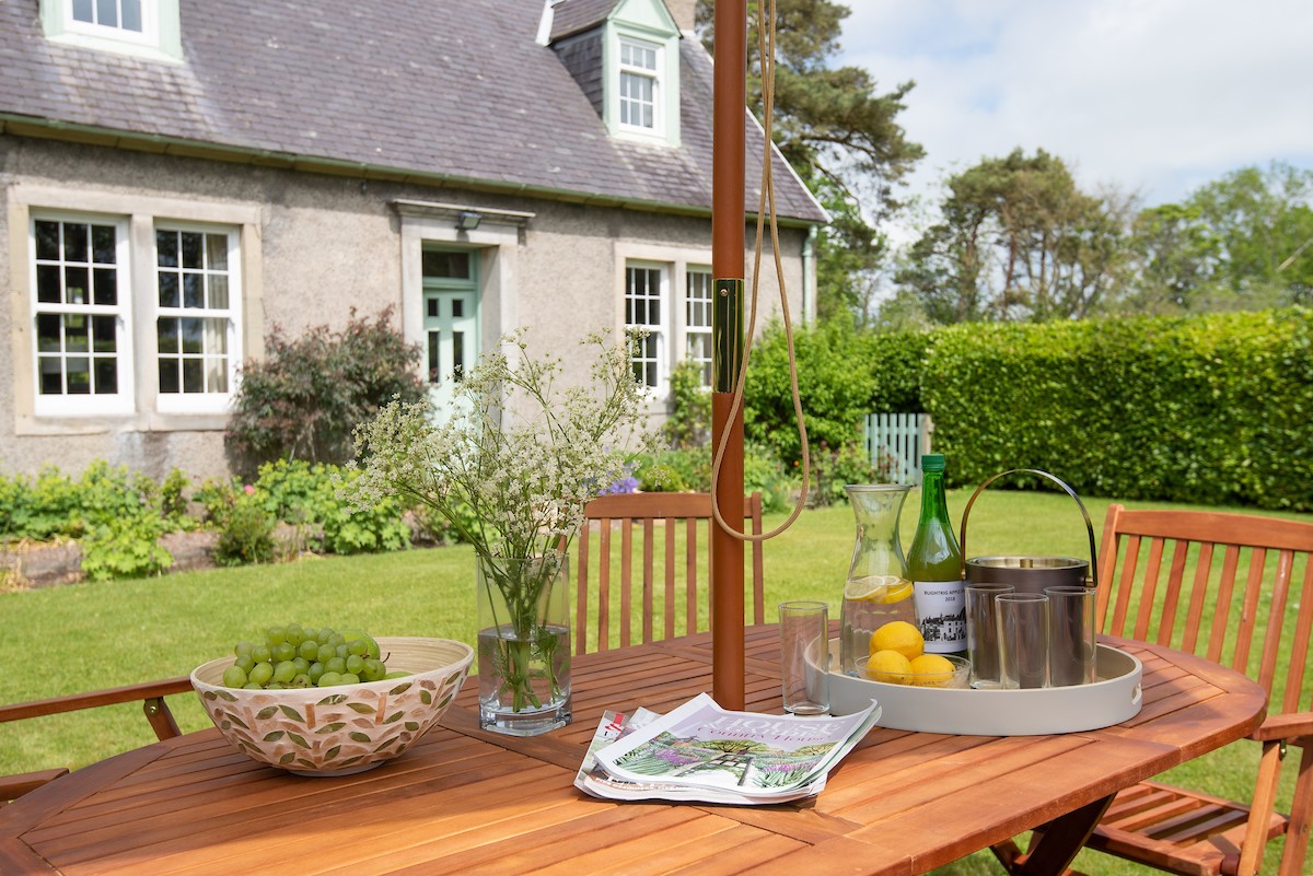 Lane Cottage - complete with an outside dining set with parasol - perfect for al fresco dining