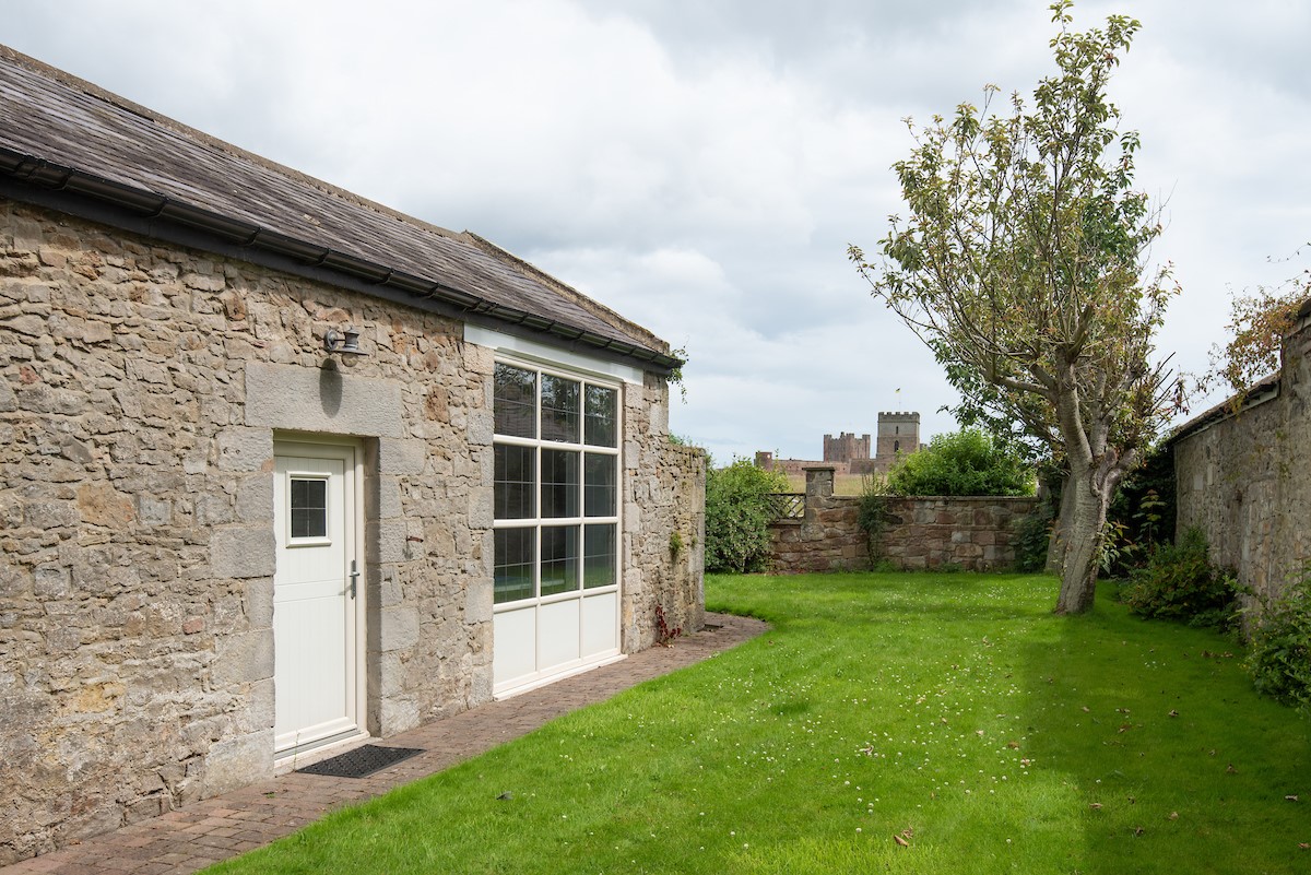 North Star House - lawned garden with partial views of Bamburgh Castle