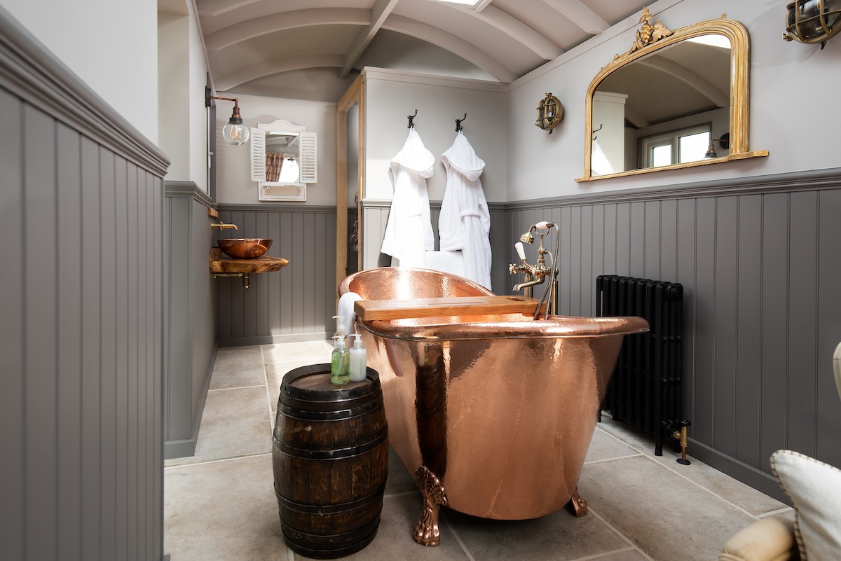 Wagtail - bathroom with copper bath and basin, fluffy bath robes are also provided