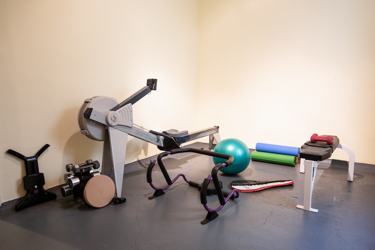 Fairnilee House - gym with rowing machine, weights and yoga mats