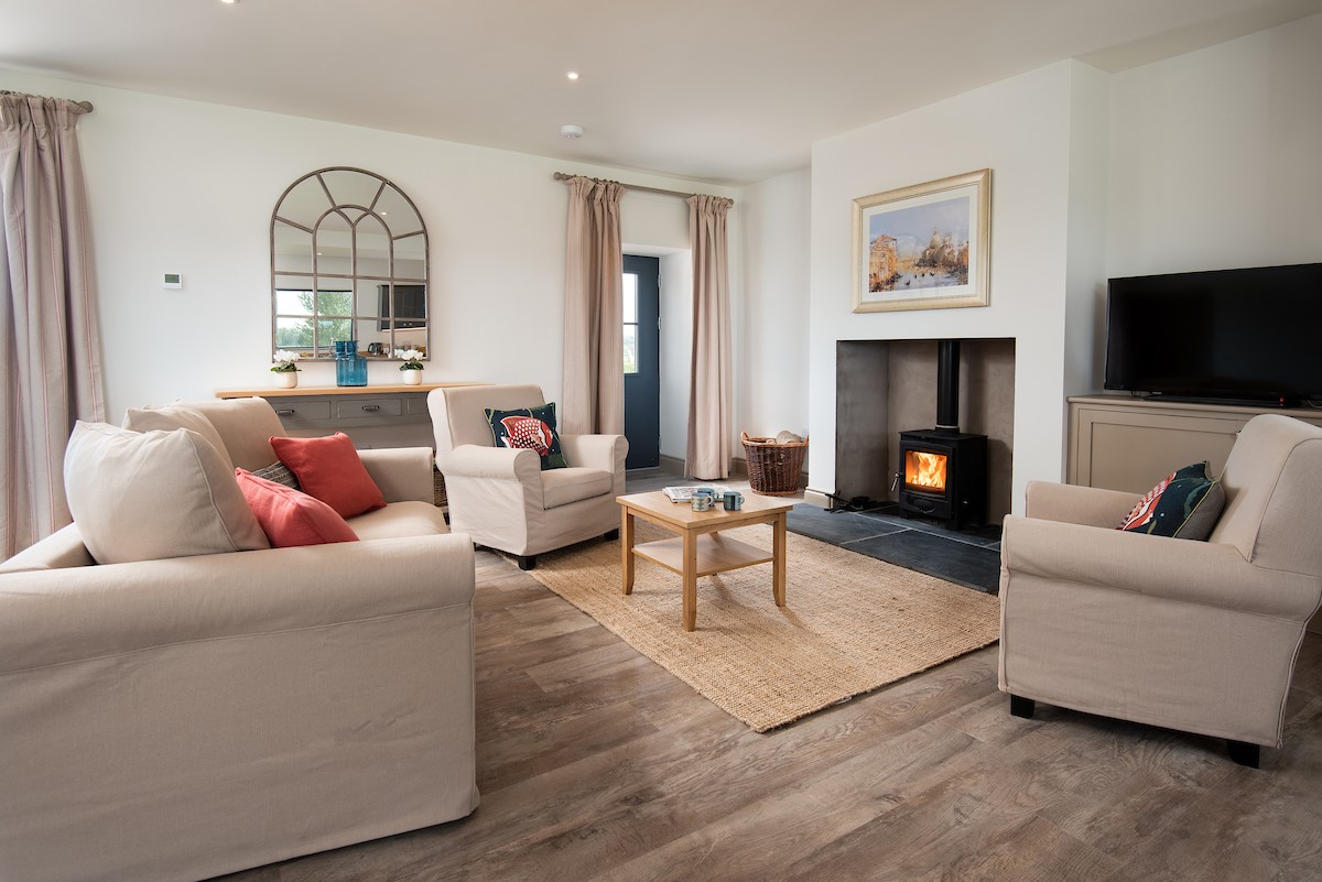 Lookout North - open plan sitting room with wood burning stove