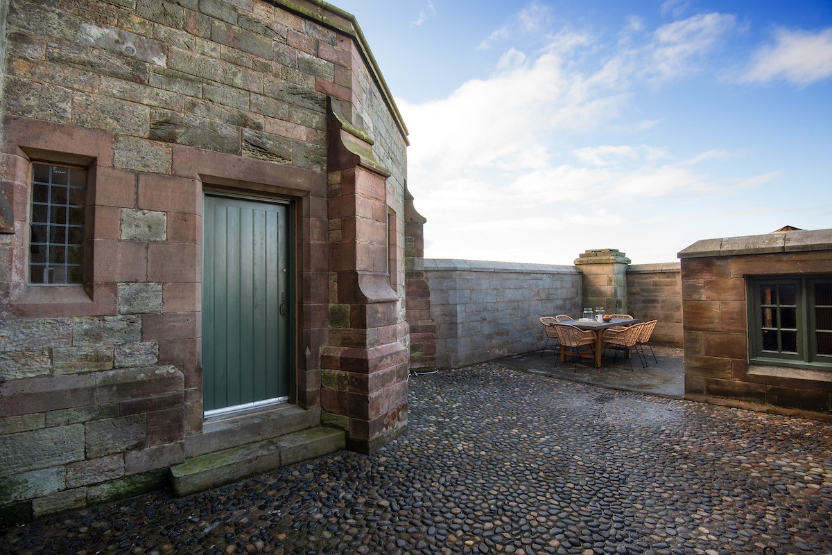 The Clock Tower at Bamburgh Tower - private courtyard with seating area