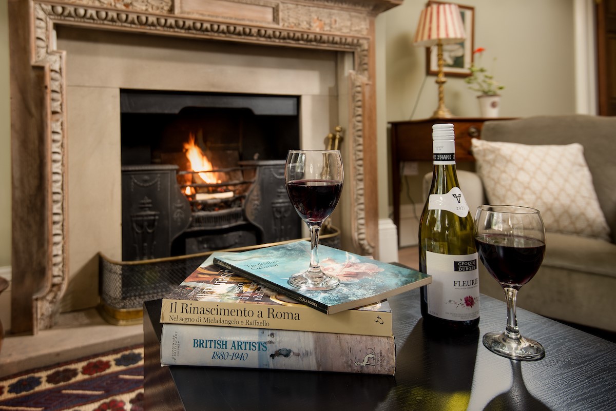 Birks Stable Cottage - enjoy a glass of wine as you relax in front of the open fire