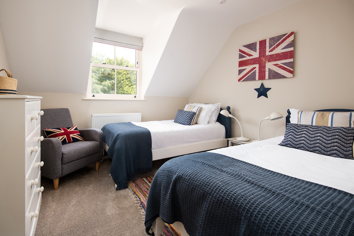Partridge Lodge - bedroom four with two full size single beds and views to the rear gardens