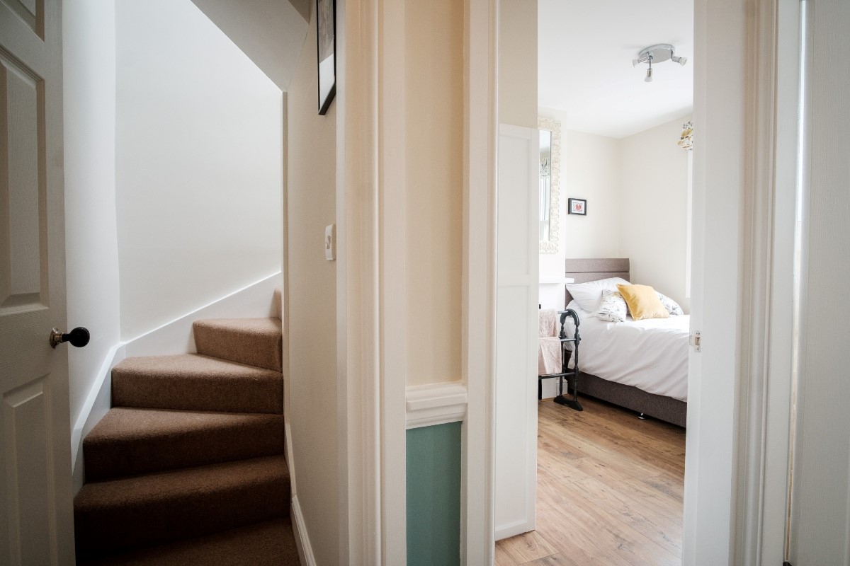 Number 107 - single bedroom and the staircase to the second floor