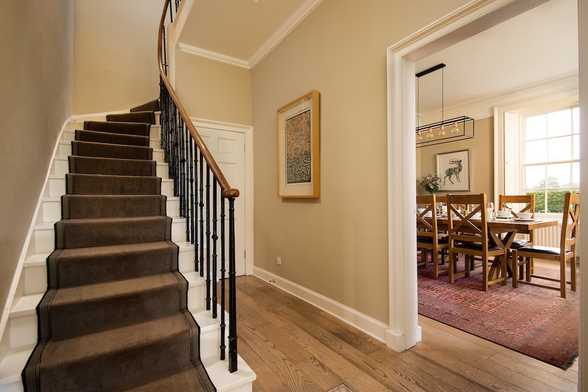 Seaview House - hallway with staircase leading to the first floor