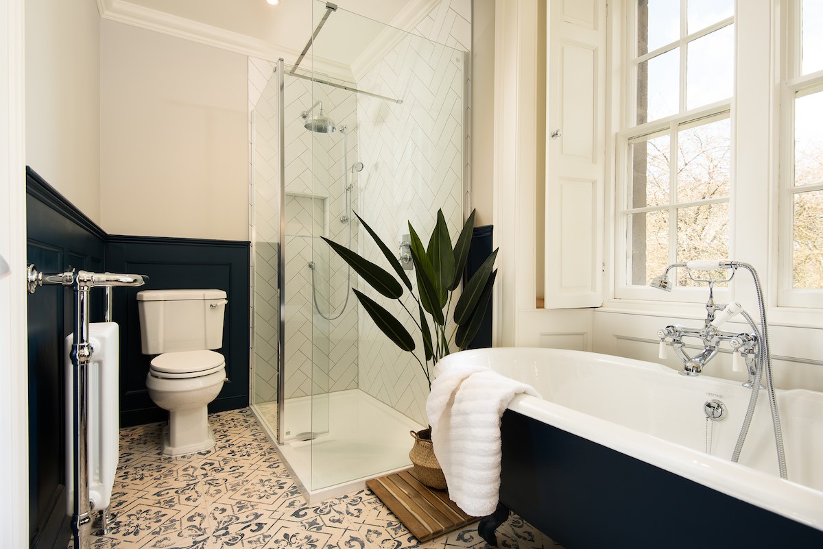 Cairnbank House - bedroom one en suite bathroom with roll top bath and large walk in shower