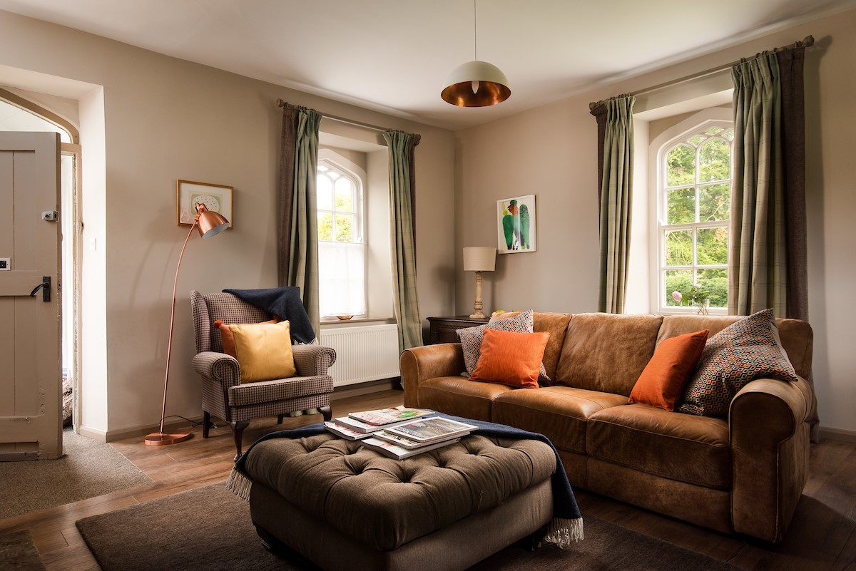 Bel House - three seater sofa to relax on after a busy day exploring