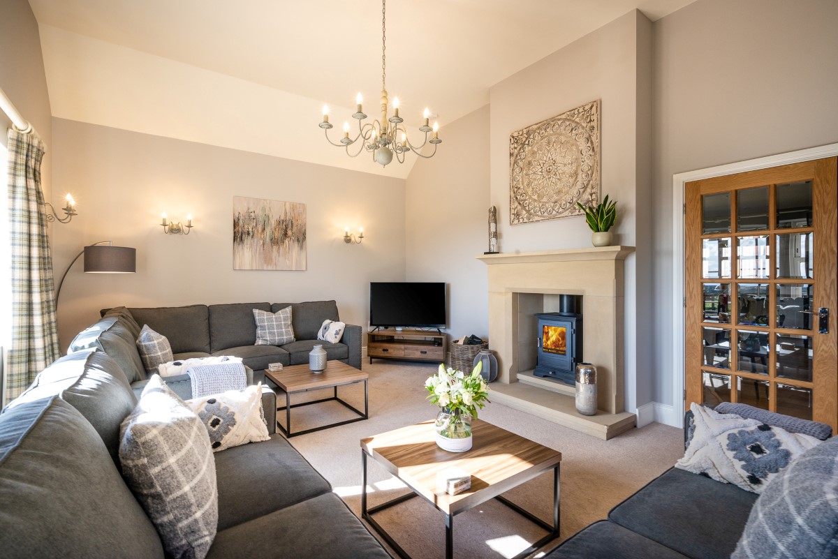 Bracken Lodge - the sitting room is spacious yet cosy with the addition of a log burner