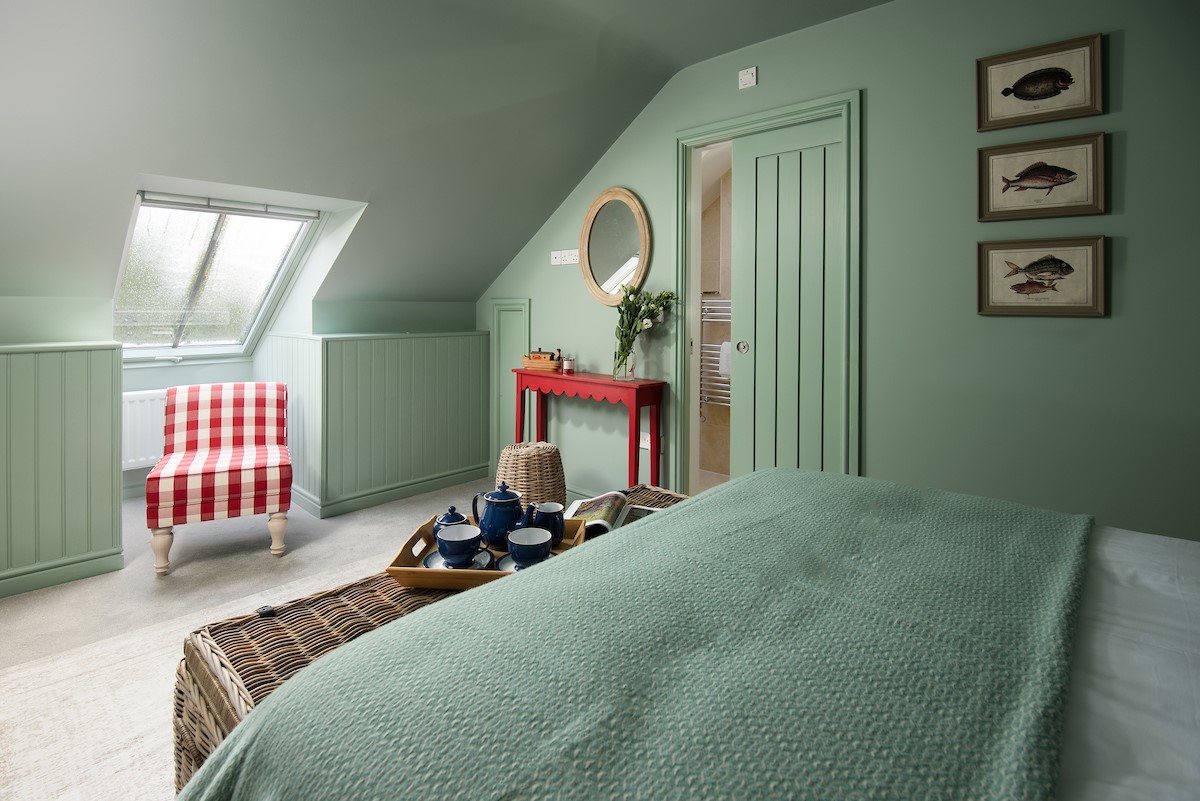 No. 6 - bedroom one on the second floor with king size bed, occasional chair and dressing table with mirror and stool
